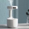 Anti-Gravity Water Drop Humidifier with digital clock, minimalist design for improved air quality and ambiance.
