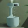 Anti-Gravity Water Drop Humidifier with digital clock function, enhancing air quality and decor in a sleek white design.