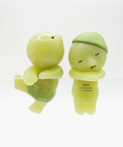 Cute green sleeping figurines with expressions, ideal for decoration and collection, adding charm to spaces.