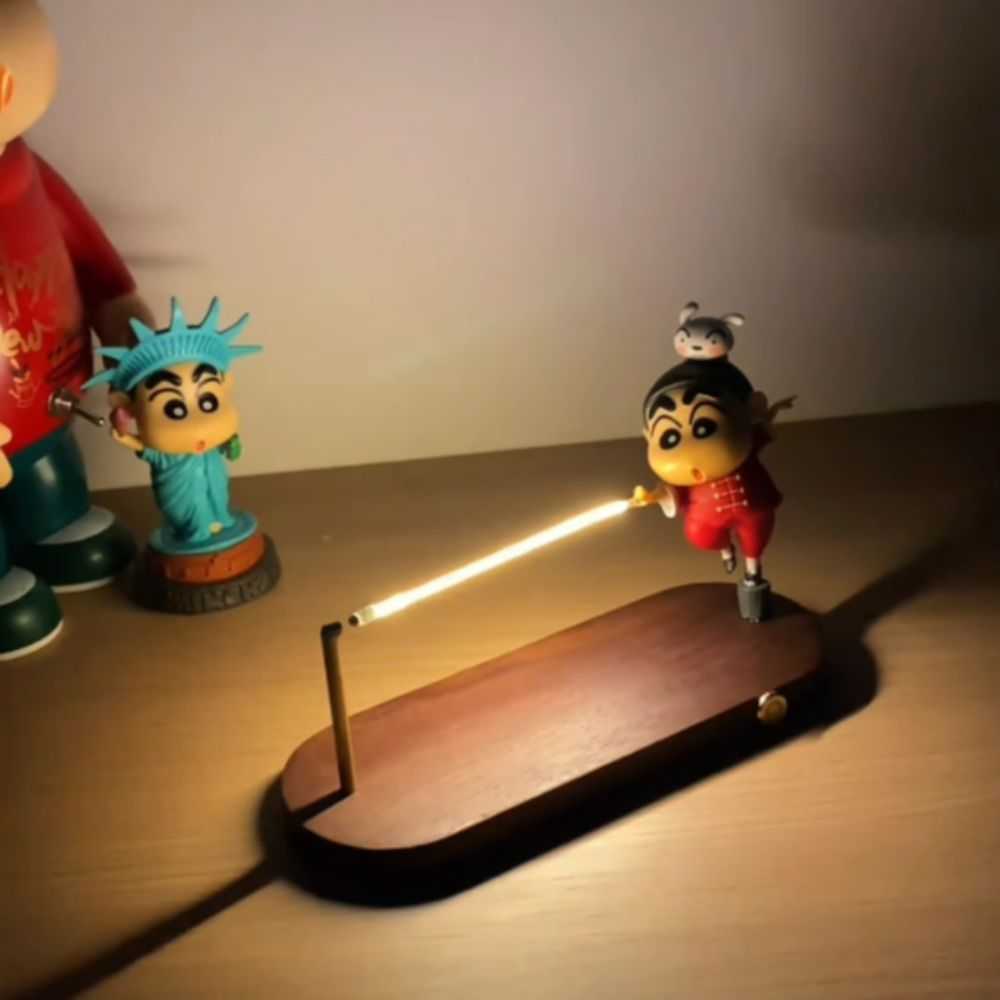 Whimsical desk lamp with cartoon character design and wooden base for playful home decor lighting.